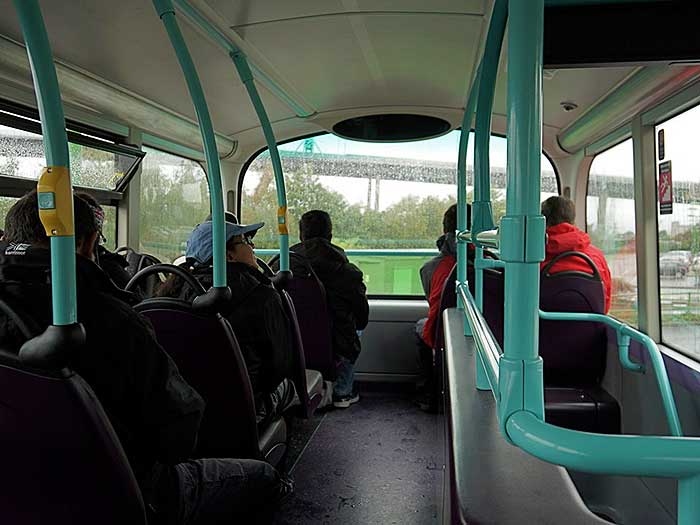 Passengers on the top deck of a bus
